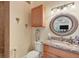 Clean bathroom with granite vanity and a walk-in shower at 200 Capstan Dr, Placida, FL 33946
