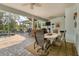 Covered patio with seating area and pool view at 200 Capstan Dr, Placida, FL 33946