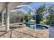 Relaxing screened pool and spa with paver deck and lush landscaping at 200 Capstan Dr, Placida, FL 33946