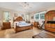 Spacious main bedroom with hardwood floors and a wooden bed frame at 200 Capstan Dr, Placida, FL 33946