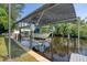 Covered boat lift for convenient boat storage at 200 Capstan Dr, Placida, FL 33946