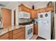 Bright kitchen featuring granite countertops and modern appliances at 200 Capstan Dr, Placida, FL 33946