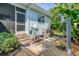 Landscaped backyard with utility area and storage at 200 Capstan Dr, Placida, FL 33946