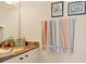 Small bathroom with granite countertop and bath towels at 200 Capstan Dr, Placida, FL 33946