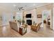 Open living room with hardwood floors and fireplace at 200 Capstan Dr, Placida, FL 33946