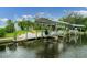 Private boat dock with covered lifts for multiple vessels at 200 Capstan Dr, Placida, FL 33946
