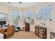 Home office with built-in shelving and plenty of natural light at 200 Capstan Dr, Placida, FL 33946