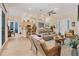 Bright living room features hardwood floors, comfortable seating, and views to kitchen at 200 Capstan Dr, Placida, FL 33946