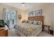 Main bedroom with king-size bed and access to outdoor patio at 200 Capstan Dr, Placida, FL 33946