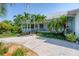 Single-story home with a metal roof and welcoming porch at 200 Capstan Dr, Placida, FL 33946