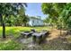 Spacious backyard with fire pit and lush landscaping at 200 Capstan Dr, Placida, FL 33946