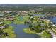 Aerial view of a community with golf course, lakes, and single Gathering homes at 10 Coral Creek Pl, Placida, FL 33946