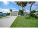 Single-story home with attached garage and palm trees at 264 Annapolis Ln, Rotonda West, FL 33947