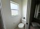 Small half bathroom with toilet and sink at 104 Mark Twain Ln, Rotonda West, FL 33947