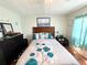 Main bedroom with a queen bed and dresser at 208 Marlette Dr, North Port, FL 34287