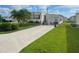 Mobile home with a palm tree and spacious yard at 208 Marlette Dr, North Port, FL 34287