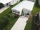 Aerial view of a manufactured home and driveway at 208 Marlette Dr, North Port, FL 34287