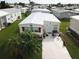 Aerial view of a mobile home with surrounding neighborhood visible at 208 Marlette Dr, North Port, FL 34287