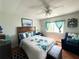 Main bedroom with a comfy queen bed and sitting area at 208 Marlette Dr, North Port, FL 34287