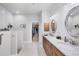 Double vanity bathroom with granite countertops and an elegant design at 283 Long Meadow Ln, Rotonda West, FL 33947