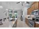 Open concept kitchen with stainless steel appliances and large island at 283 Long Meadow Ln, Rotonda West, FL 33947