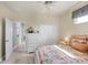 Charming bedroom with a queen bed, dresser, and access to the hallway at 283 Long Meadow Ln, Rotonda West, FL 33947