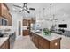 Island kitchen features granite countertops and stainless steel appliances at 283 Long Meadow Ln, Rotonda West, FL 33947