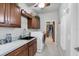 Laundry room with washer, dryer, sink, and cabinets at 283 Long Meadow Ln, Rotonda West, FL 33947