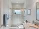 Updated bathroom with a large walk in shower and granite vanity at 283 Long Meadow Ln, Rotonda West, FL 33947