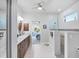 Elegant bathroom with double vanity, walk-in shower, and access to bedroom at 283 Long Meadow Ln, Rotonda West, FL 33947