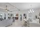 Open floor plan living room and kitchen with gray furniture and tile floor at 283 Long Meadow Ln, Rotonda West, FL 33947
