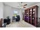 Home office with built-in shelving, desk, and large window at 283 Long Meadow Ln, Rotonda West, FL 33947