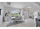 Bright dining room with a round table and access to the foyer at 283 Long Meadow Ln, Rotonda West, FL 33947