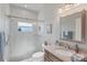 Modern bathroom with a large shower and granite countertop vanity at 283 Long Meadow Ln, Rotonda West, FL 33947