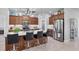 Modern kitchen with stainless steel appliances and an island with seating at 283 Long Meadow Ln, Rotonda West, FL 33947