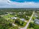 Aerial view of a single-story house with a large lot and surrounding trees at 5332 Ulysses St, Port Charlotte, FL 33981