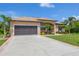 Single-story home with garage and well-maintained landscaping at 191 Brig W Cir, Placida, FL 33946
