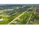 Aerial view of a residential area with houses and green spaces at 191 Brig W Cir, Placida, FL 33946