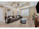 Open living room with hardwood floors, large windows, and neutral color palette at 191 Brig W Cir, Placida, FL 33946