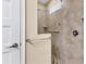 Walk-in shower with tiled walls and grab bar at 191 Brig W Cir, Placida, FL 33946