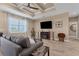Spacious living room featuring hardwood floors, a ceiling fan, and a flat-screen TV at 191 Brig W Cir, Placida, FL 33946