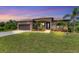 One-story house with a screened patio and lush lawn at 191 Brig W Cir, Placida, FL 33946