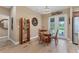 Bright dining area with glass table and four chairs, adjacent to kitchen and living room at 191 Brig W Cir, Placida, FL 33946
