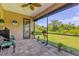 Relaxing screened porch overlooking backyard and pool at 191 Brig W Cir, Placida, FL 33946