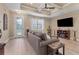 Bright living room with hardwood floors, a comfy sofa, and a fireplace at 191 Brig W Cir, Placida, FL 33946