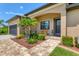 Inviting entryway with landscaping and a paved walkway at 191 Brig W Cir, Placida, FL 33946