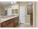 Double vanity bathroom with granite countertop and walk-in shower at 191 Brig W Cir, Placida, FL 33946