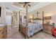 Main bedroom with a post bed and en-suite bathroom access at 191 Brig W Cir, Placida, FL 33946