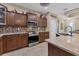 Modern kitchen with granite countertops, custom cabinetry, and stainless steel appliances at 191 Brig W Cir, Placida, FL 33946