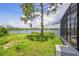 Serene backyard oasis with lake view and screened enclosure at 32 Harness Rd, Placida, FL 33946